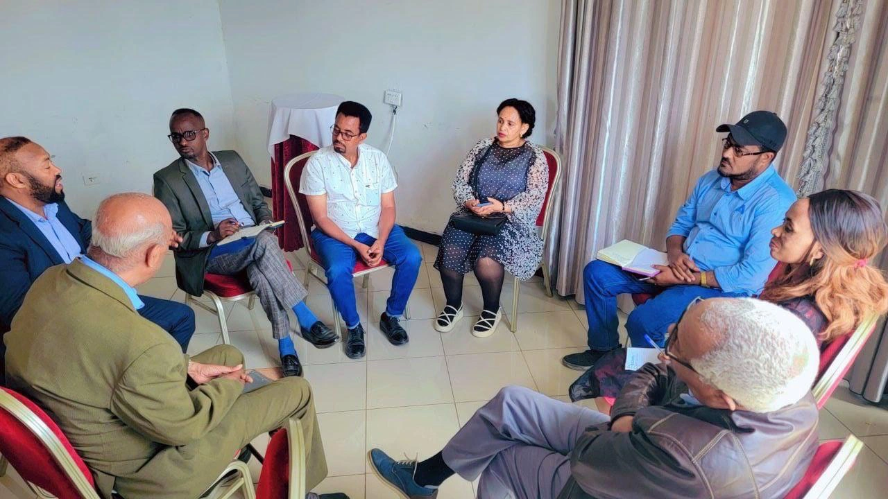 REACH Ethiopia leaders talking together in a small group